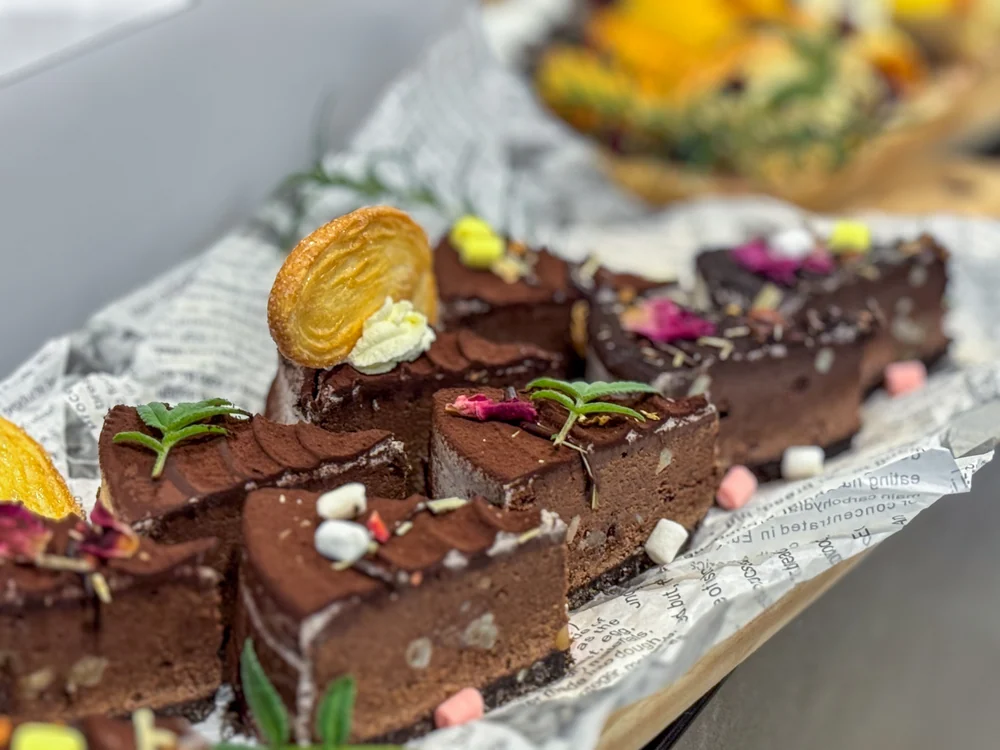 Chocolate cake and puff pastries on the LOHERB buffet table