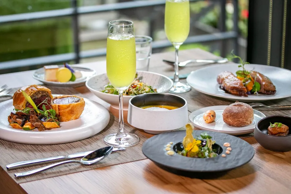 A set-menu table and main course at Loherb Cuisine