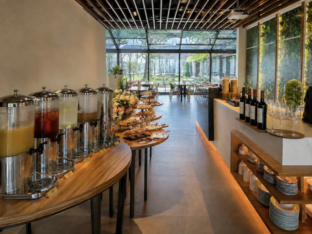 A gathering at the Herb Villa Café with drinks and food laid out along the counter