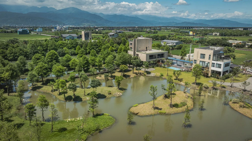 Aerial view of the T+H buildings, poolside and water features