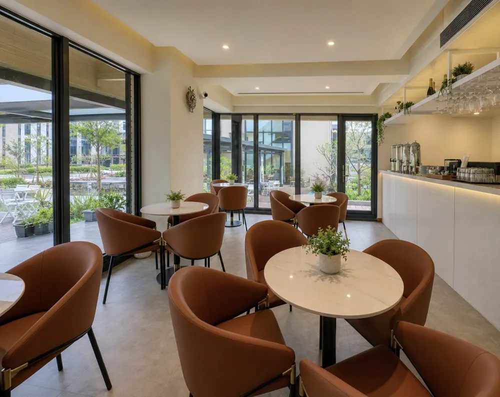 Round-table seating and bright windows in the Tree Villa Lobby